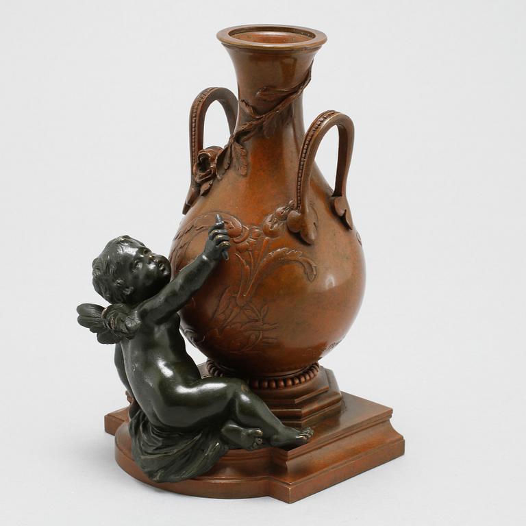 A patinated bronze vase after Auguste Moreau, made around year 1900.