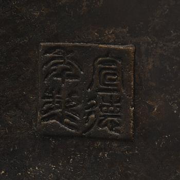A large bronze censer with cover, presumably late Ming dynasty (1368-1644).