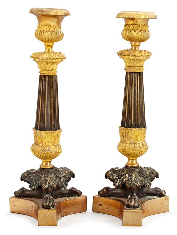 A pair of French late Empire candlesticks.
