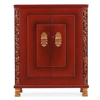 474. A red lacquered cabinet with carved and bronzed decoration 'à la chinoise', by Otto Wretling, Umeå, Sweden 1930's.