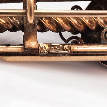 A 14K gold brooch with pearls and garnet glass doublet.