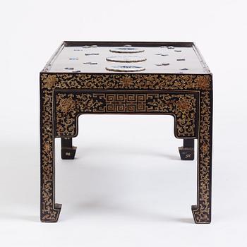 A Chinese black lacquered table with porcelain placques, presumably first half of the 20th century.