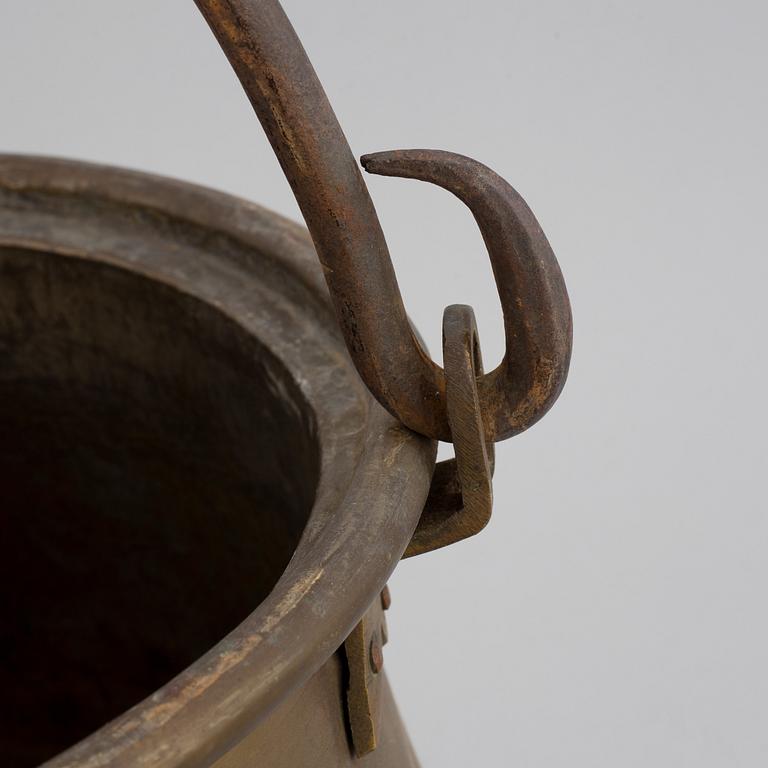 A large 18th century brass cauldron.