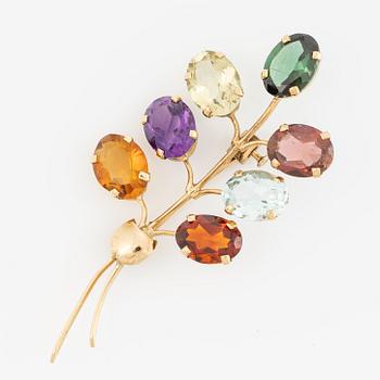 Brooch, 18K gold with citrine, amethyst, and tourmaline among others.