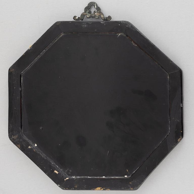 Four black-lacquered wall decorations, China, around 1900.