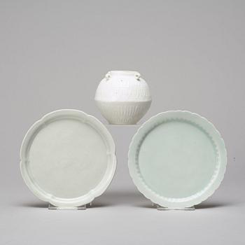 Two celadon glazed dishes and a white glazed jar, South East Asia, presumably 12th/17th Century.