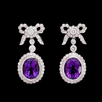 838. A pair of amethyst and brilliant cut diamond earrings, tot. 1.44 ct.
