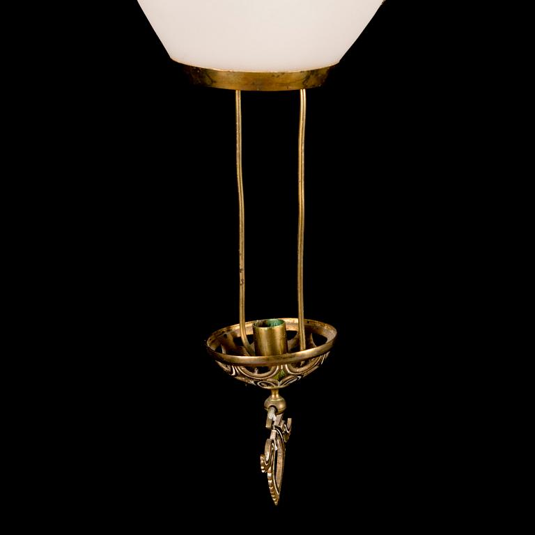 An early 20th Century opaline glass and brass ceiling light.