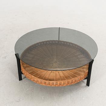 A late 20th century glas, metal and wicker coffee table.