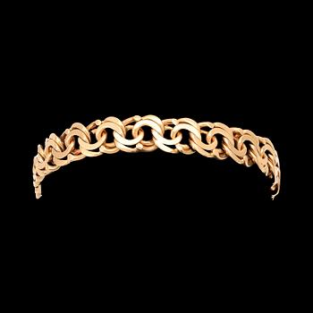 An 18K gold Bismarck bracelet.