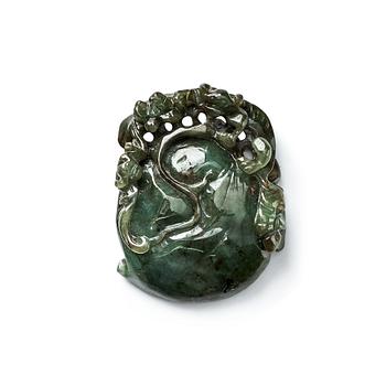 672. A Chinese green stone carving/pendant with a monkey and a bat by a peach.