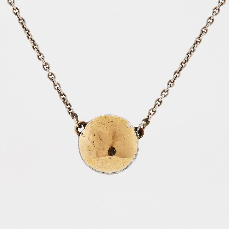 A pendant set with a rose-cut diamond.
