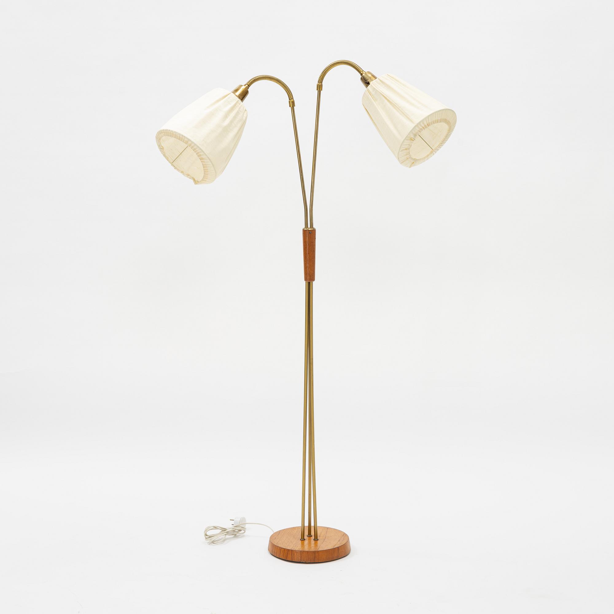 A brass and teak floor light, 1950's.