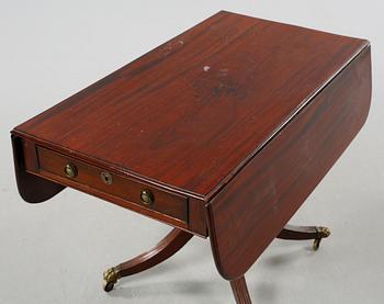 A drop-leaf table, English style, late 19th century.