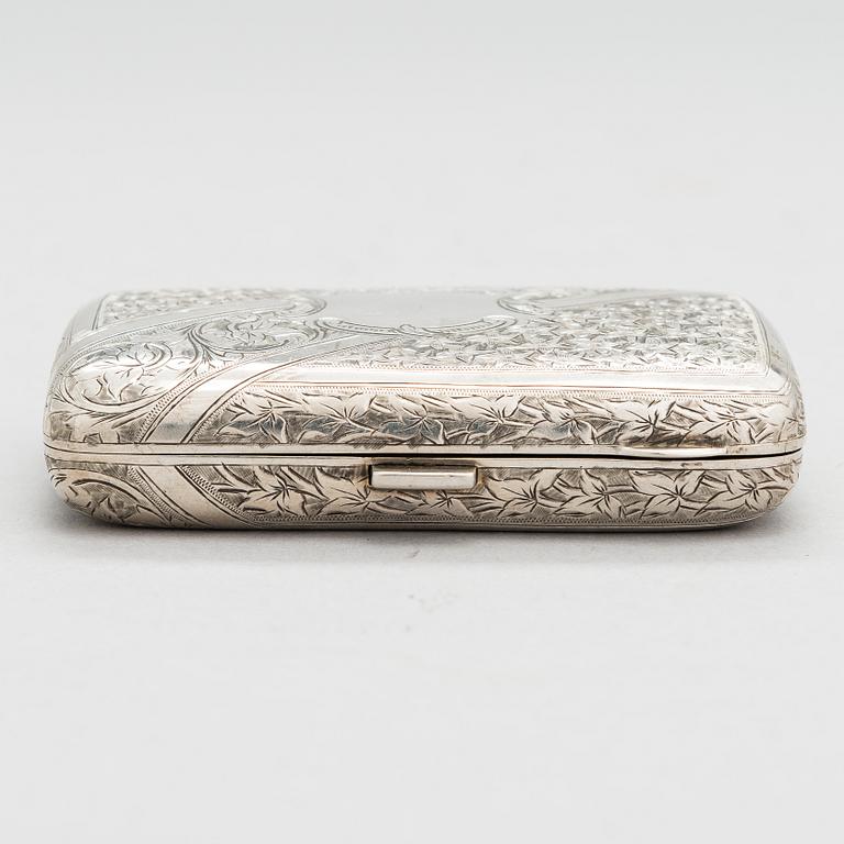 An English sterling silver cigarette case, maker's mark William M. Hayes, of Birmingham, 1896.