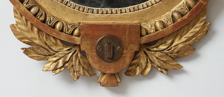 A late gustavian girandole mirror signed by Claes Eric Reding, Karlskrona, (master 1808-1815).