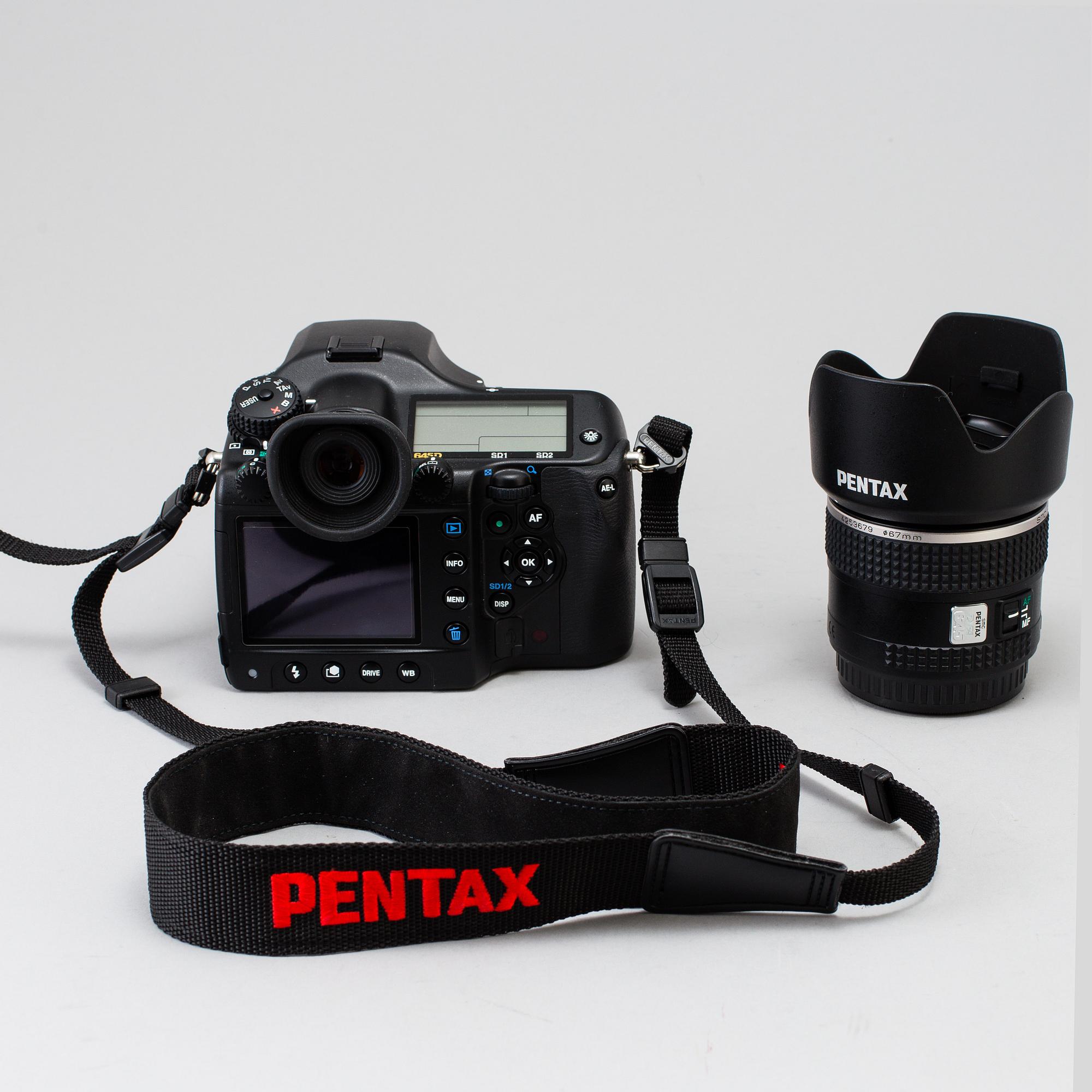A black body medium format Pentax 645D camera with a SMC Pentax-D FA 645 55mm F2.8 AL [IF] SDM AW lens.