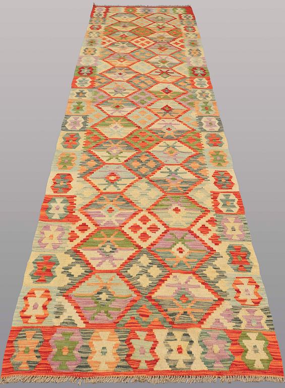 A runner kilim, ca 391 x 88 cm.