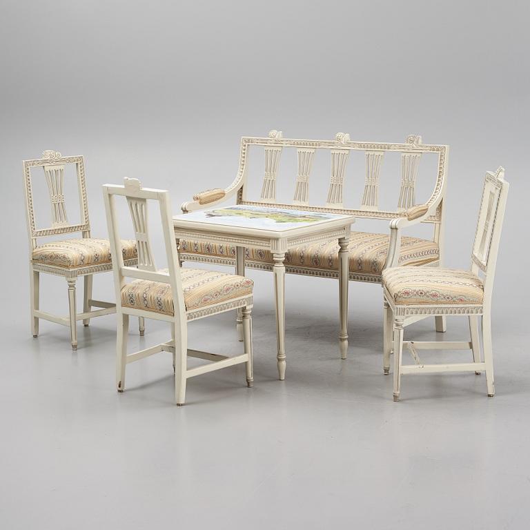 A sofa, three chairs and a table, Gustaivan style and of the Gustavian period, 19th-20th century.