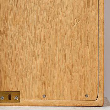 James Krenov, an oak or doussie showcase wall cabinet, executed in his own workshop, Bromma, Sweden.