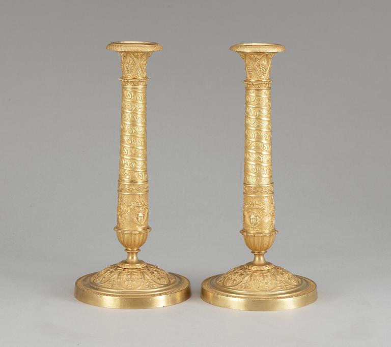 A pair of French Empire early 19th century candlesticks.