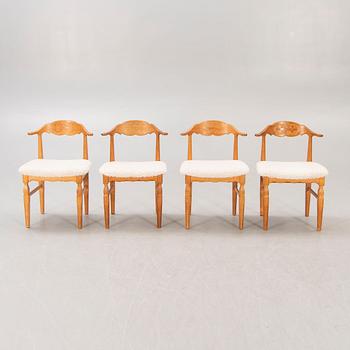 A set of 14 Henning Kjaerulf 1950s oak chairs.