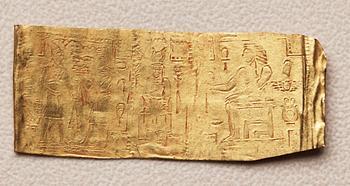 A set of nine presumably modern Egyptian-style gold foil sheets with figures and hieroglyphs.