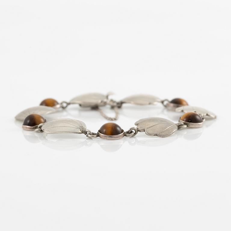 Two bracelets, Victor Janson, silver, one set with tiger's eye.
