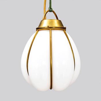 A contemporary 'Hobo' brass and glass pendant lamp by Gustaf Nordenskiöld for Örsjö.