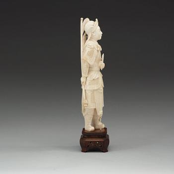 A carved ivory figure of a soldier in arms, late Qing dynasty, circa 1900.