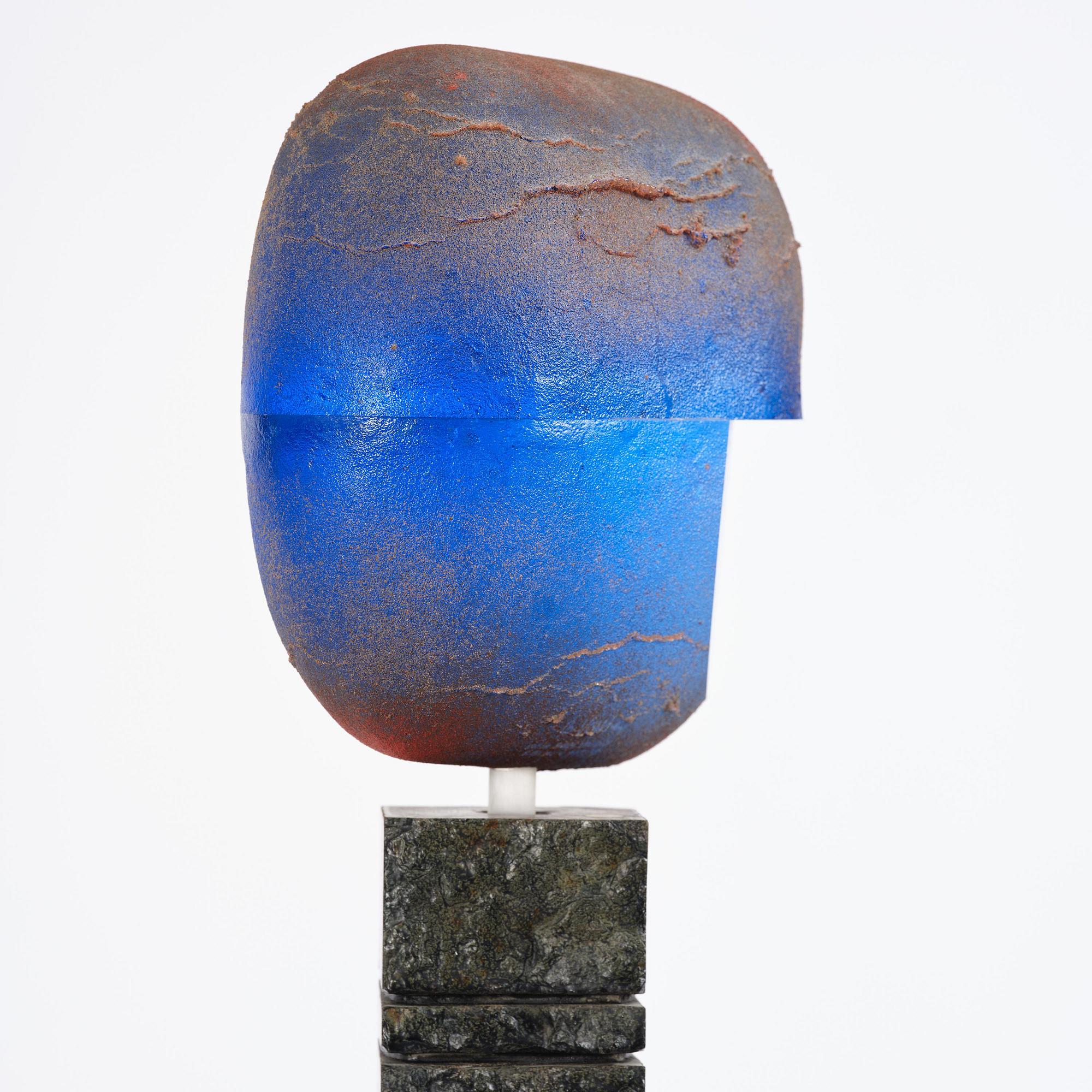 Bertil Vallien, a unique sand-cast glass sculpture of a head, on a high pedestal of polished limestone, Kosta Boda.