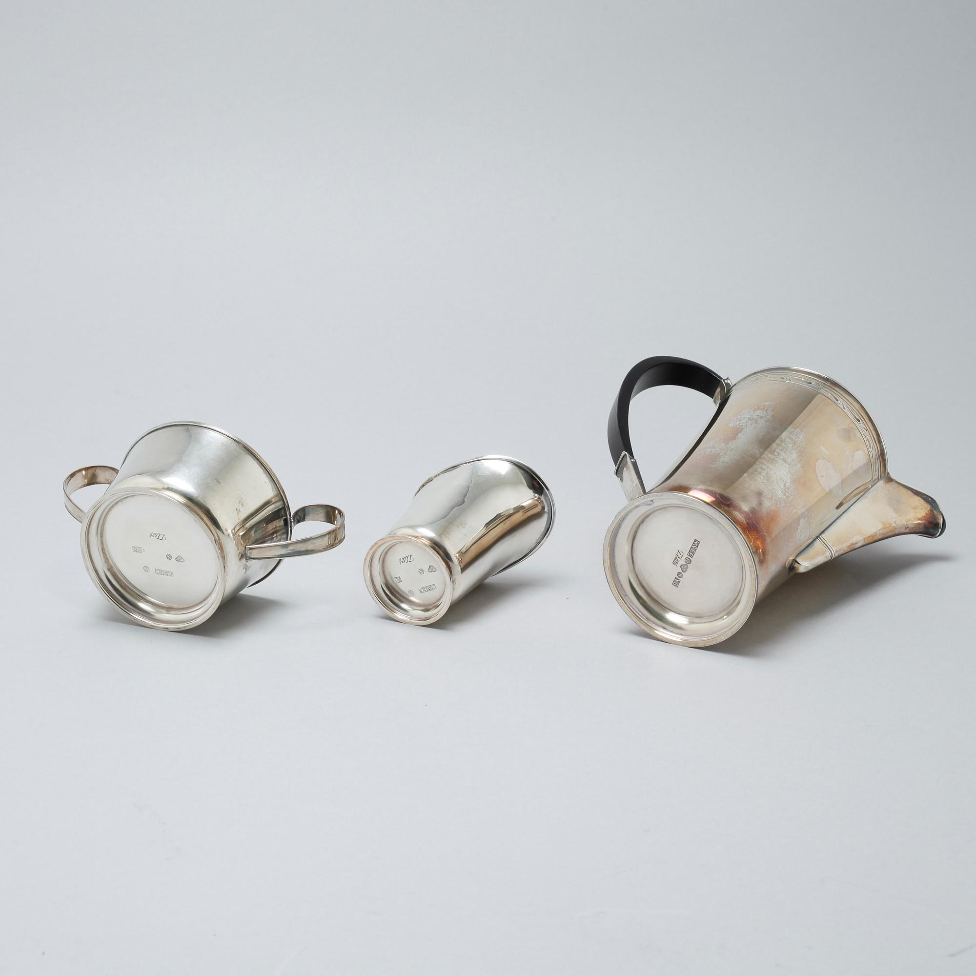 A silver coffee pot, sugar bowl and creamer by Thore Eldh for K&EC in Göteborg, 1949.