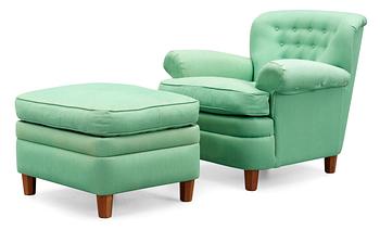 325. A Josef Frank armchair with ottoman, by Svenskt Tenn, model 568.