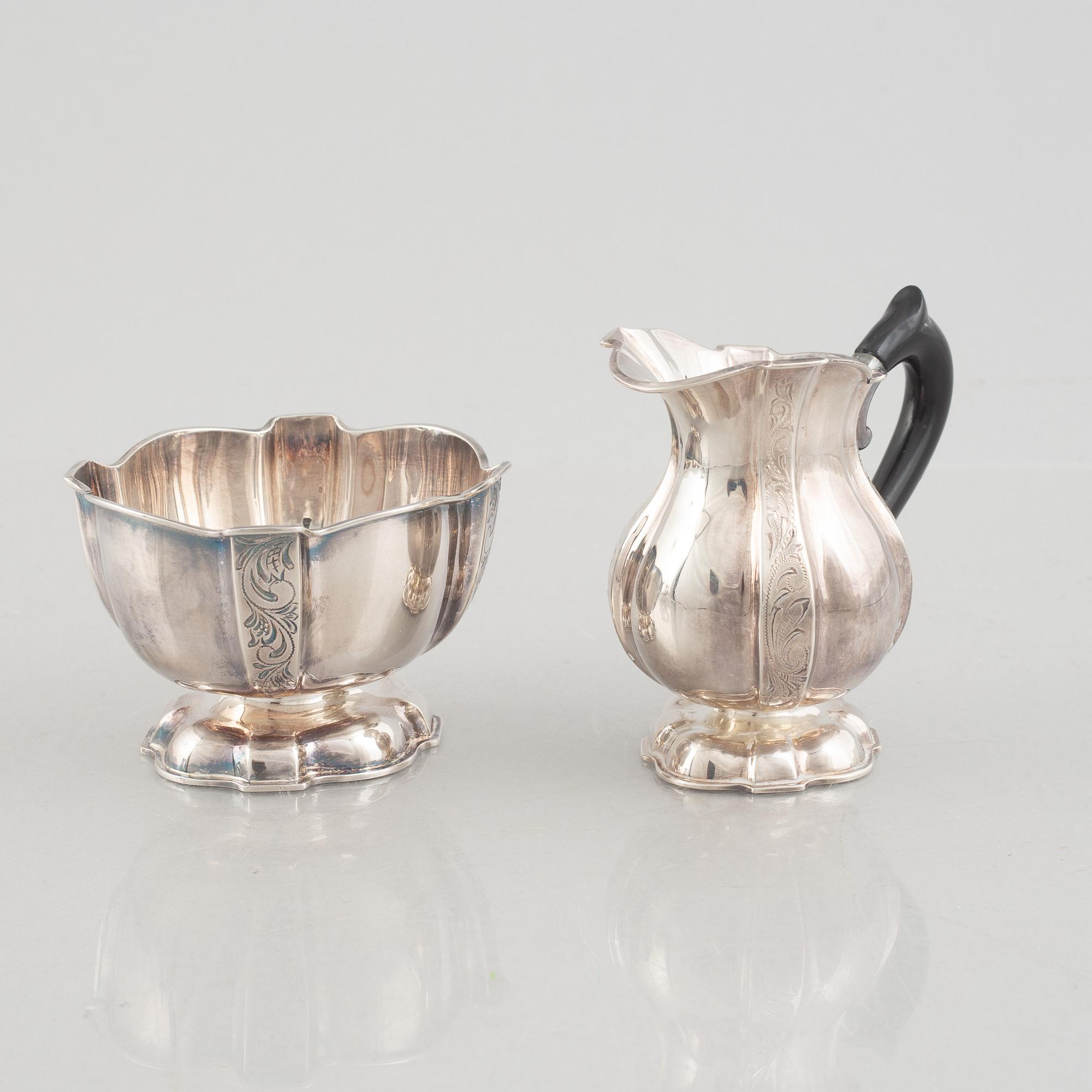 A silver coffee pot, creamer and sugarbowl, Swedish import marks, JL Hultman, circa mid-20th century.