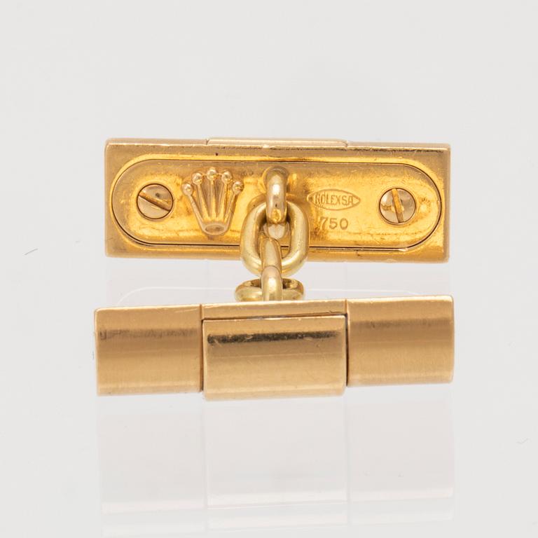 A pair of 18K gold cufflinks by Rolex.