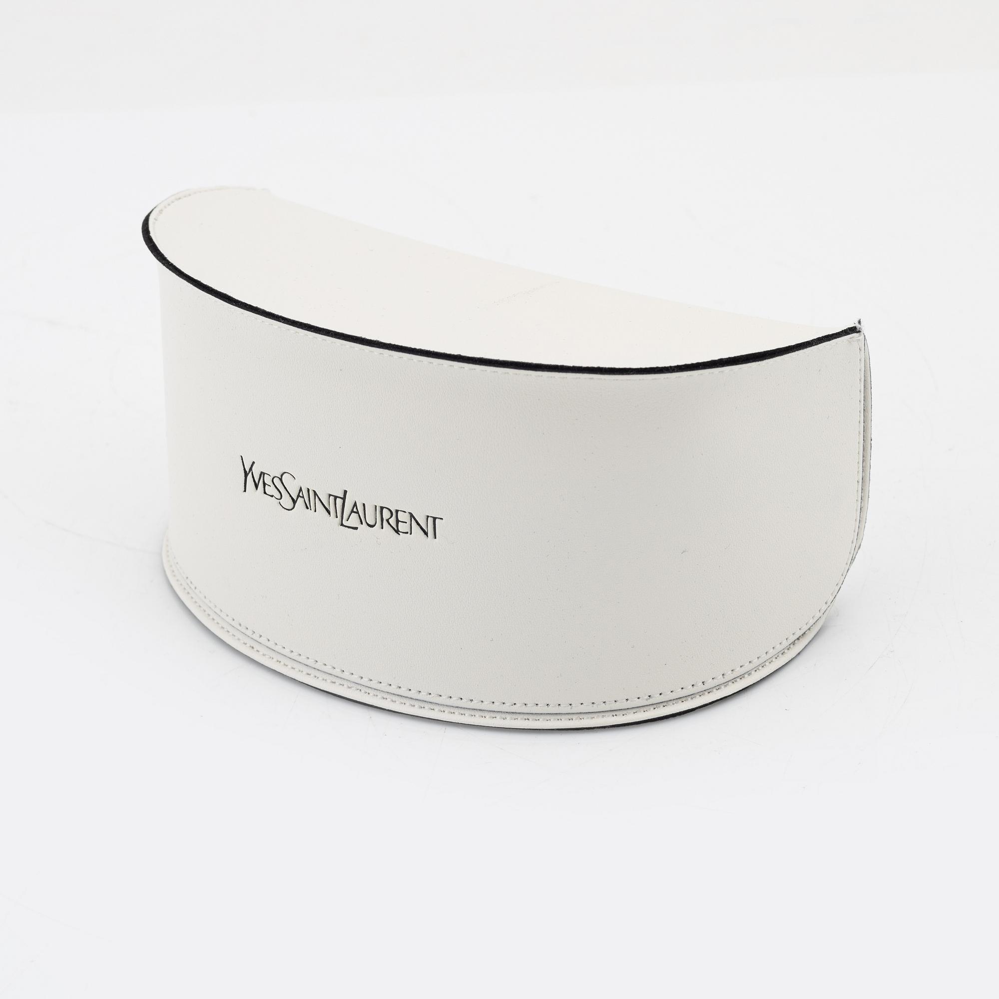 Yves Saint Laurent, a pair of grey plastic sunglasses.