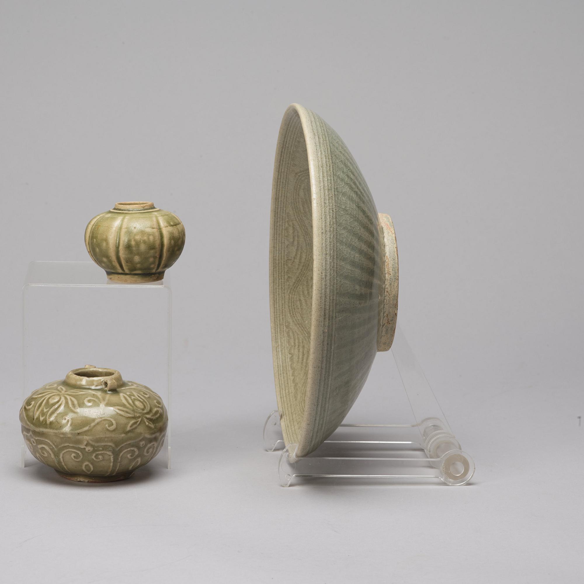 Two olive green glazed jars and a dish, South East Asia, 14th/15th Century.