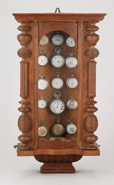 FICKURSSKÅP, 15 st fickur i nyrenässans fodral, 1800-talets slut.