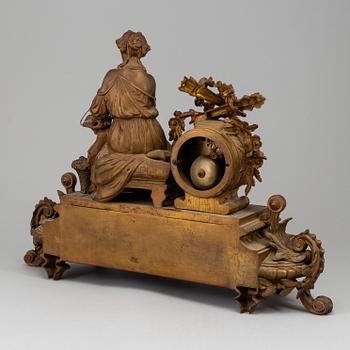 A  French 19th century mantle clock in Louis-XVI style.