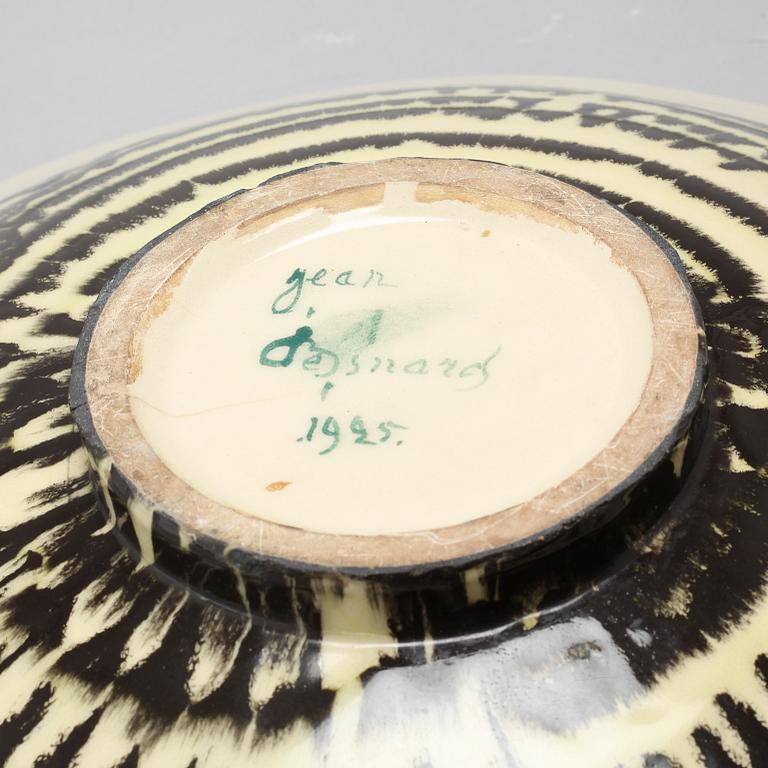 JEAN BESNARD, a glazed ceramic charger, France, signed and dated 1925.