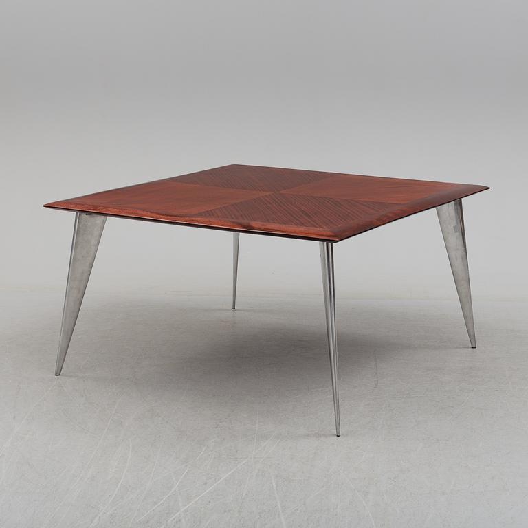 a dining table by Philippe Starck, "M Serie Lang", Driad.