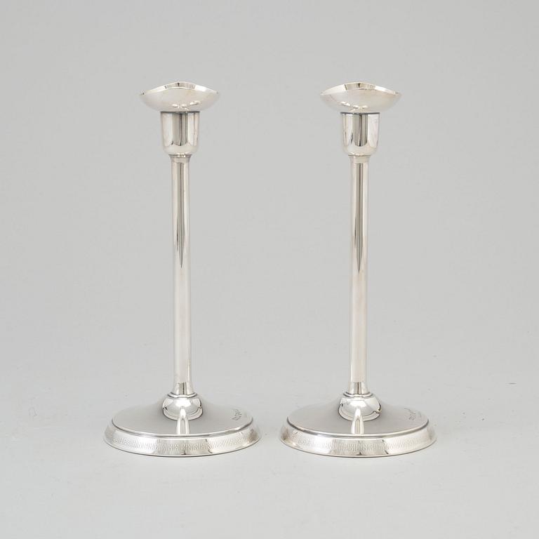 A pair of silver candlesticks by GAB, Stockholm, 1970.