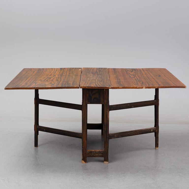 A 19th Century painted gate leg table.