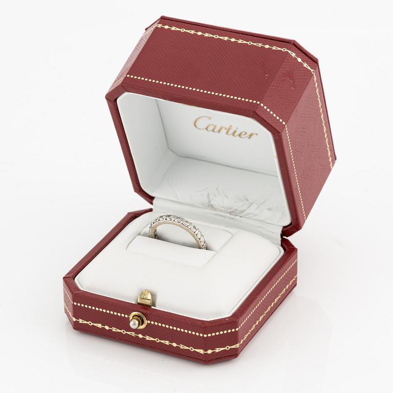 Cartier alliance ring in white gold with round brilliant-cut diamonds.