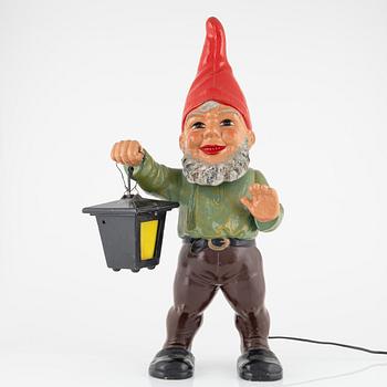 A West German earthenware gnome figurine with lantern from the second half of the 20th century.