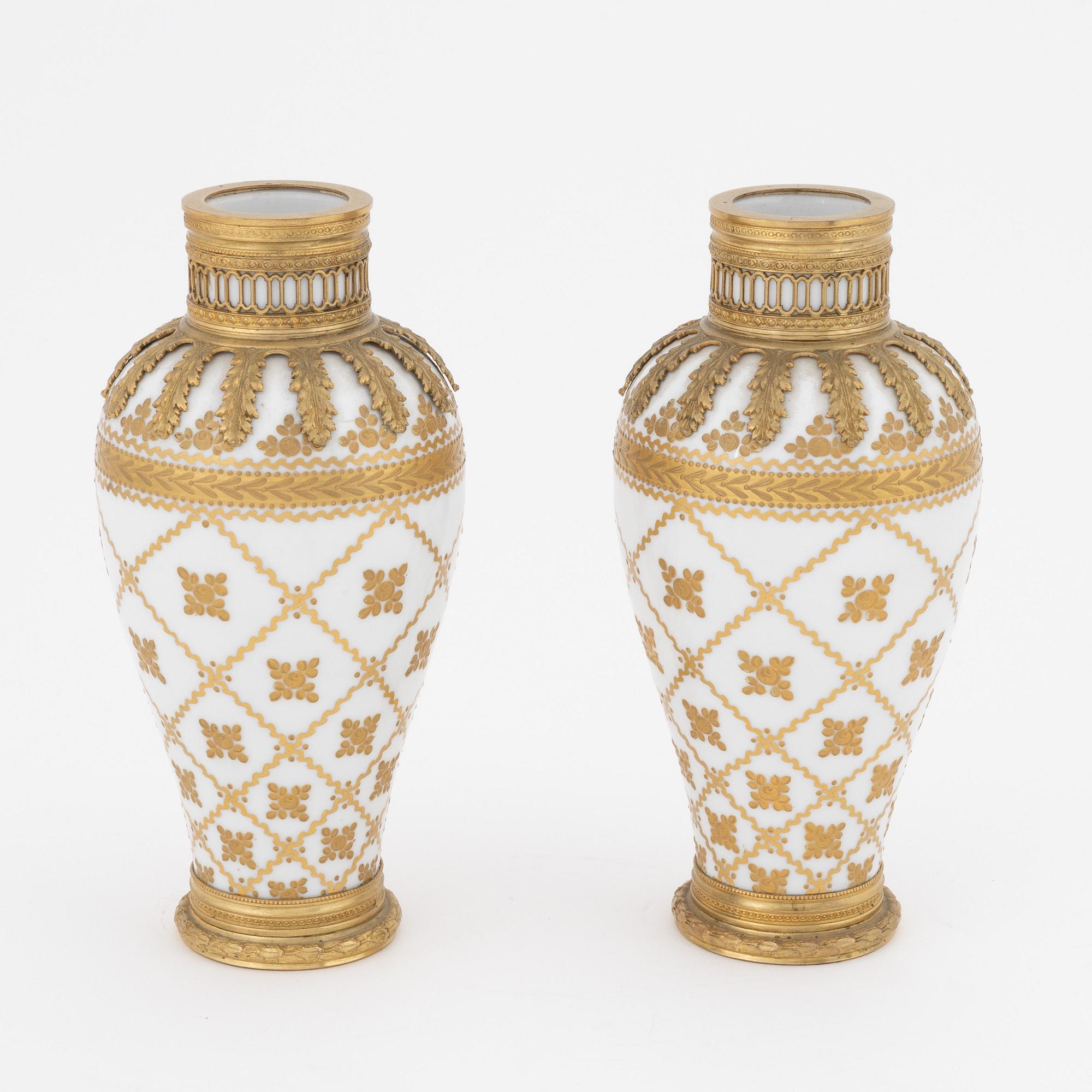 A pair of brass-mounted porcelain  vases, Sèvres mock marks, around 1900.