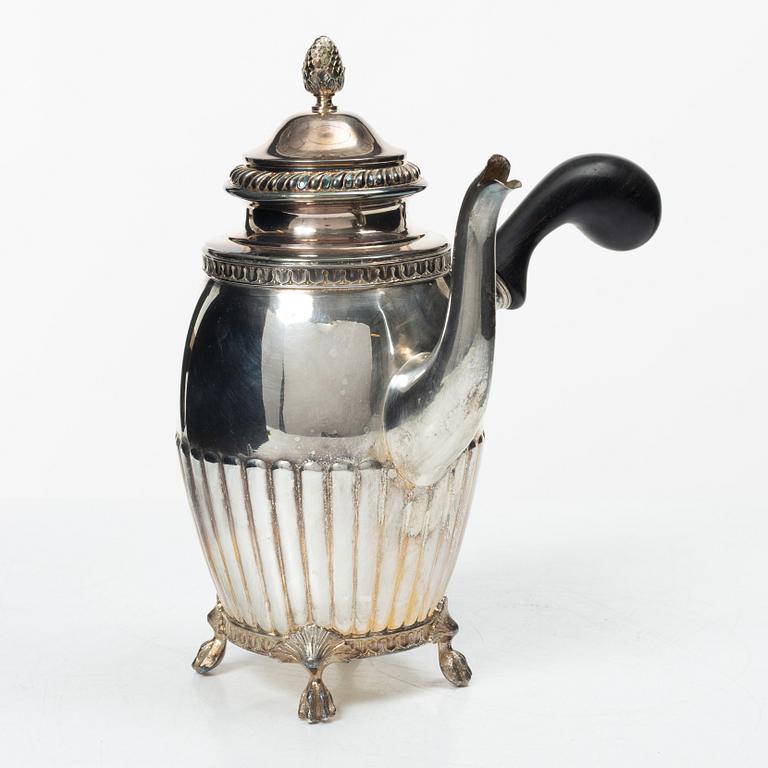 A Swedish silver coffee pot, cream jug and sugar box, Gustavian style, mark of AG Dufva, Stockholm 1911-1912.