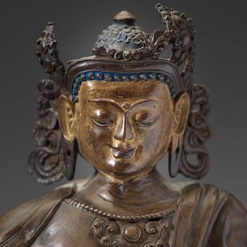 A copper alloy and gilt repoussé Bodhisattva, 17th/18th century.