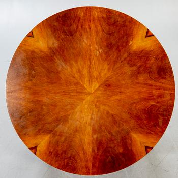 An Art Deco style walnut coffee table later part of the 20th century.