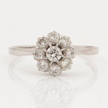 An 18K white gold ring set with round brilliant cut diamonds.